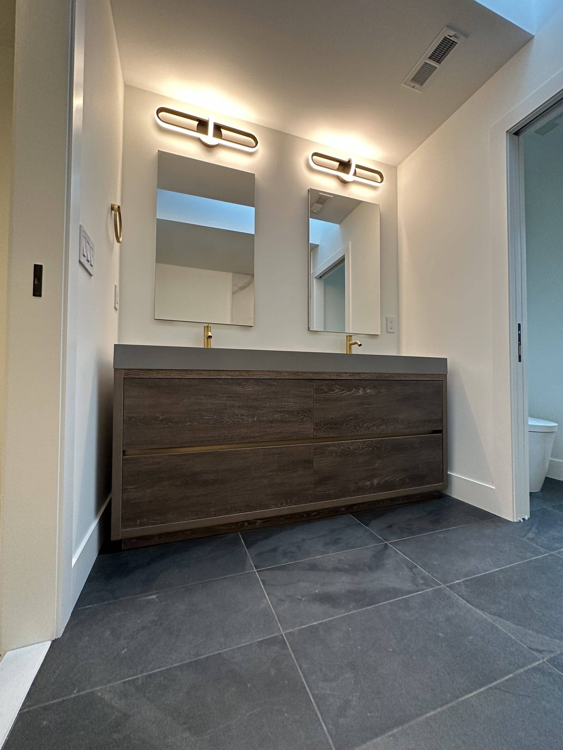bathroom sink made of dark stained wood
